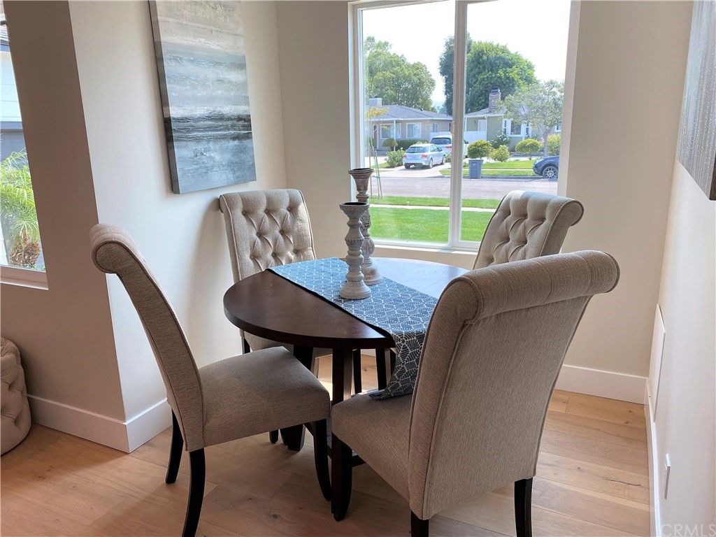 5035 Avenue B Torrance, CA 90505 - Photo 16 of 60 a view of a dining room with furniture wooden floor and a potted plant