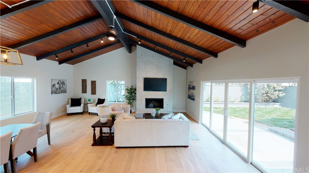 5035 Avenue B Torrance, CA 90505 - Photo 18 of 60 a living room with furniture a fireplace and a flat screen tv