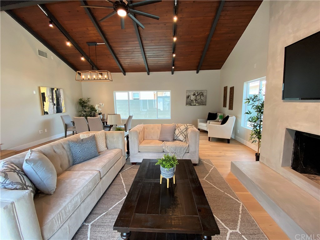 5035 Avenue B Torrance, CA 90505 - Photo 21 of 60 a living room with furniture a flat screen tv and a fireplace