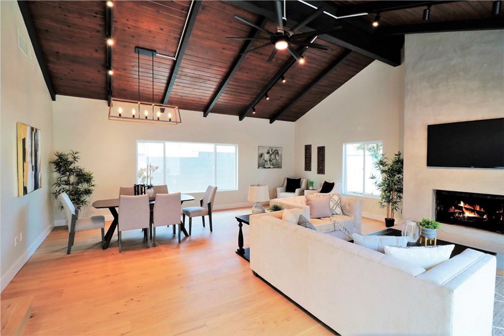 5035 Avenue B Torrance, CA 90505 - Photo 24 of 60 a living room with furniture a fireplace and a flat screen tv