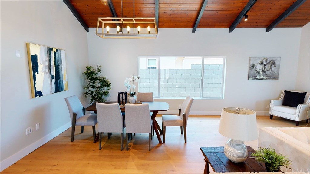 5035 Avenue B Torrance, CA 90505 - Photo 27 of 60 a dining room with furniture a chandelier and window