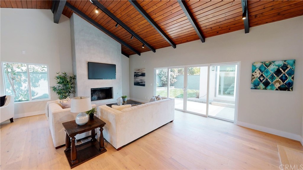 5035 Avenue B Torrance, CA 90505 - Photo 28 of 60 a living room with furniture large window and a fireplace