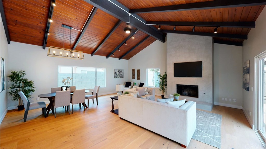5035 Avenue B Torrance, CA 90505 - Photo 29 of 60 a living room with furniture a fireplace and a table