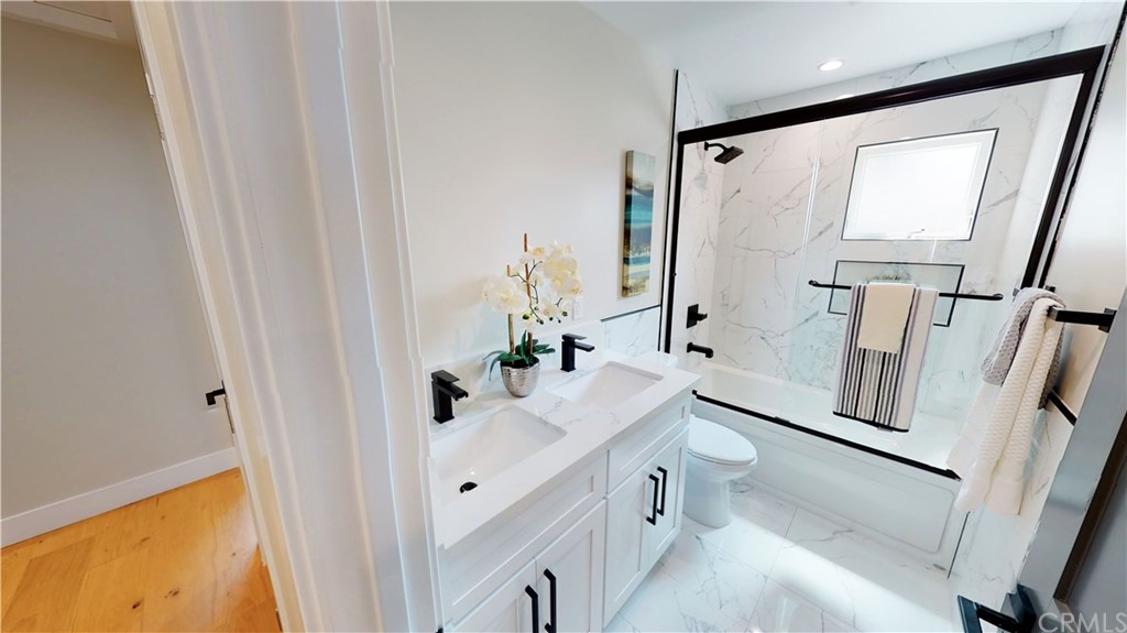 5035 Avenue B Torrance, CA 90505 - Photo 44 of 60 a bathroom with a granite countertop sink toilet and shower