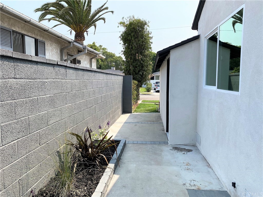 5035 Avenue B Torrance, CA 90505 - Photo 59 of 60 a potted plant sitting in front of a house