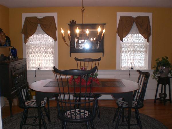 948 Cronin Road Warren, MA 01585 - Photo 11 of 25 a view of a dining room with furniture window and wooden floor
