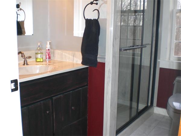 948 Cronin Road Warren, MA 01585 - Photo 21 of 25 a bathroom with a sink vanity and a mirror