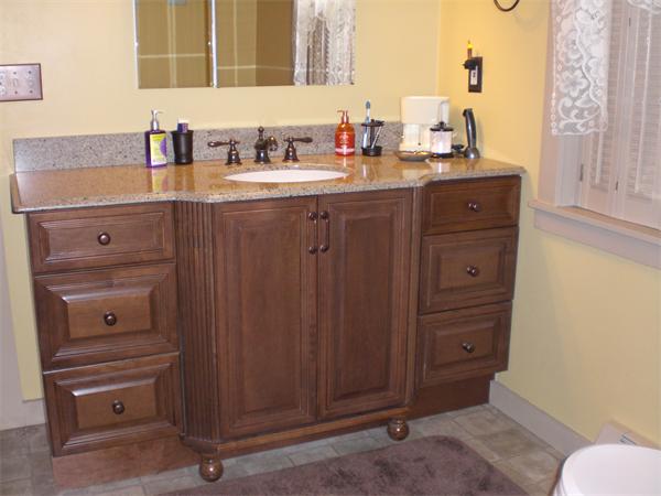 948 Cronin Road Warren, MA 01585 - Photo 23 of 25 a bathroom with a granite countertop sink and a mirror
