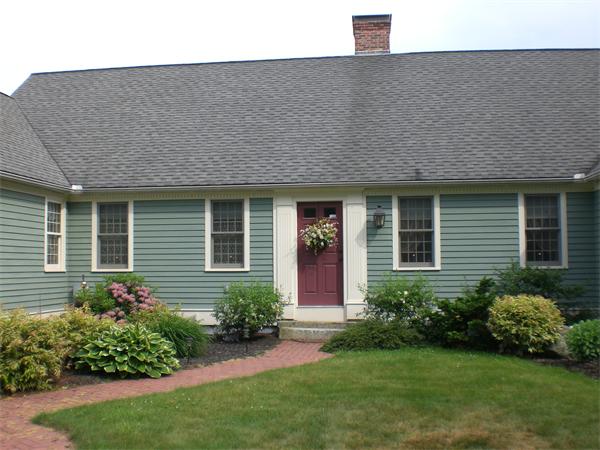 948 Cronin Road Warren, MA 01585 - Photo 3 of 25 a front view of a house with a garden