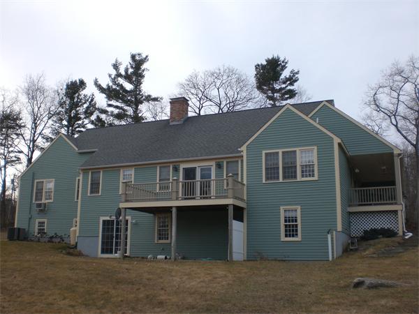 948 Cronin Road Warren, MA 01585 - Photo 4 of 25 a front view of a house with a yard