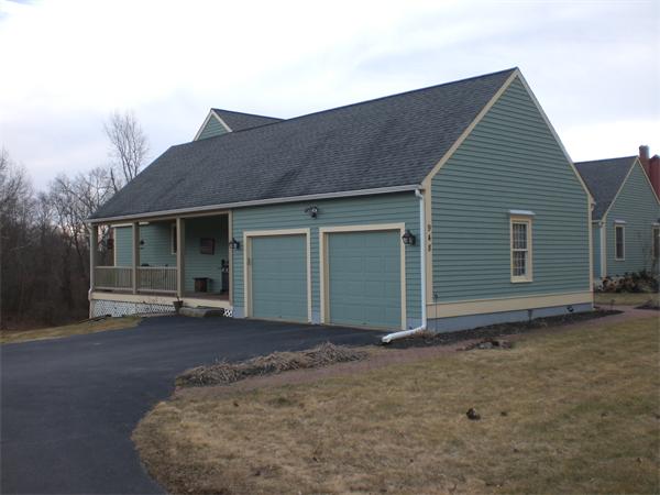 948 Cronin Road Warren, MA 01585 - Photo 5 of 25 a front view of a house with a garage
