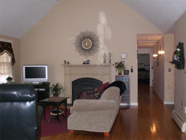 948 Cronin Road Warren, MA 01585 - Photo 8 of 25 a living room with furniture and a fireplace