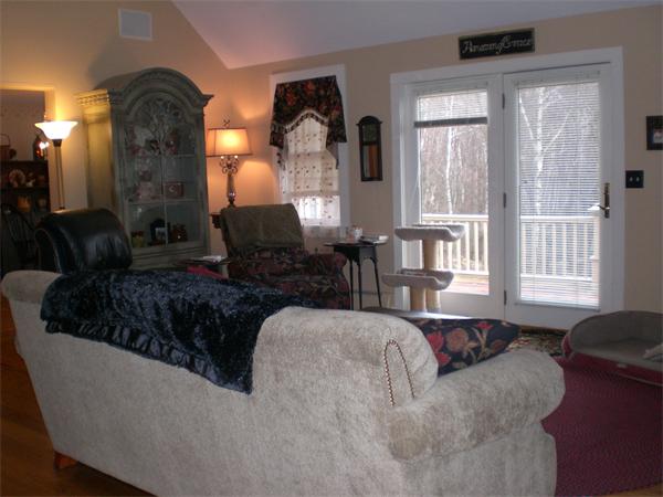 948 Cronin Road Warren, MA 01585 - Photo 10 of 25 a living room with furniture and a large window