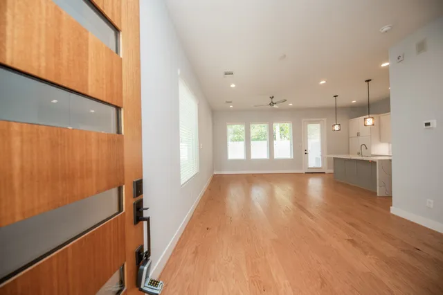 a view of an entryway with wooden floor