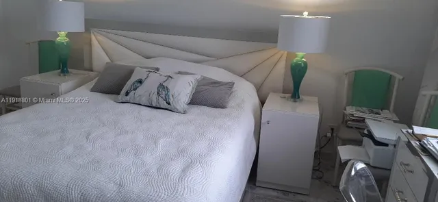 a bed room with furniture and a wooden floor