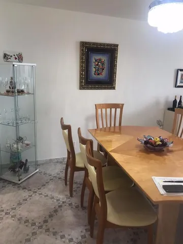 a view of a dining room and chairs