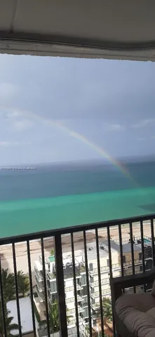 a balcony with a yard