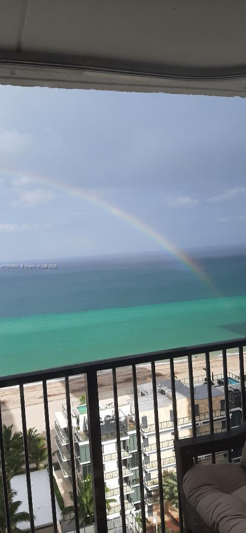 2101 South Ocean Drive, Unit 1802 Hollywood, FL 33019 - Photo 5 of 8 a balcony with a yard