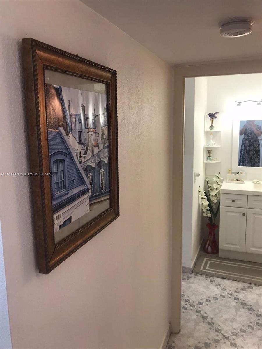 2101 South Ocean Drive, Unit 1802 Hollywood, FL 33019 - Photo 7 of 8 a view of a hallway with washer and dryer