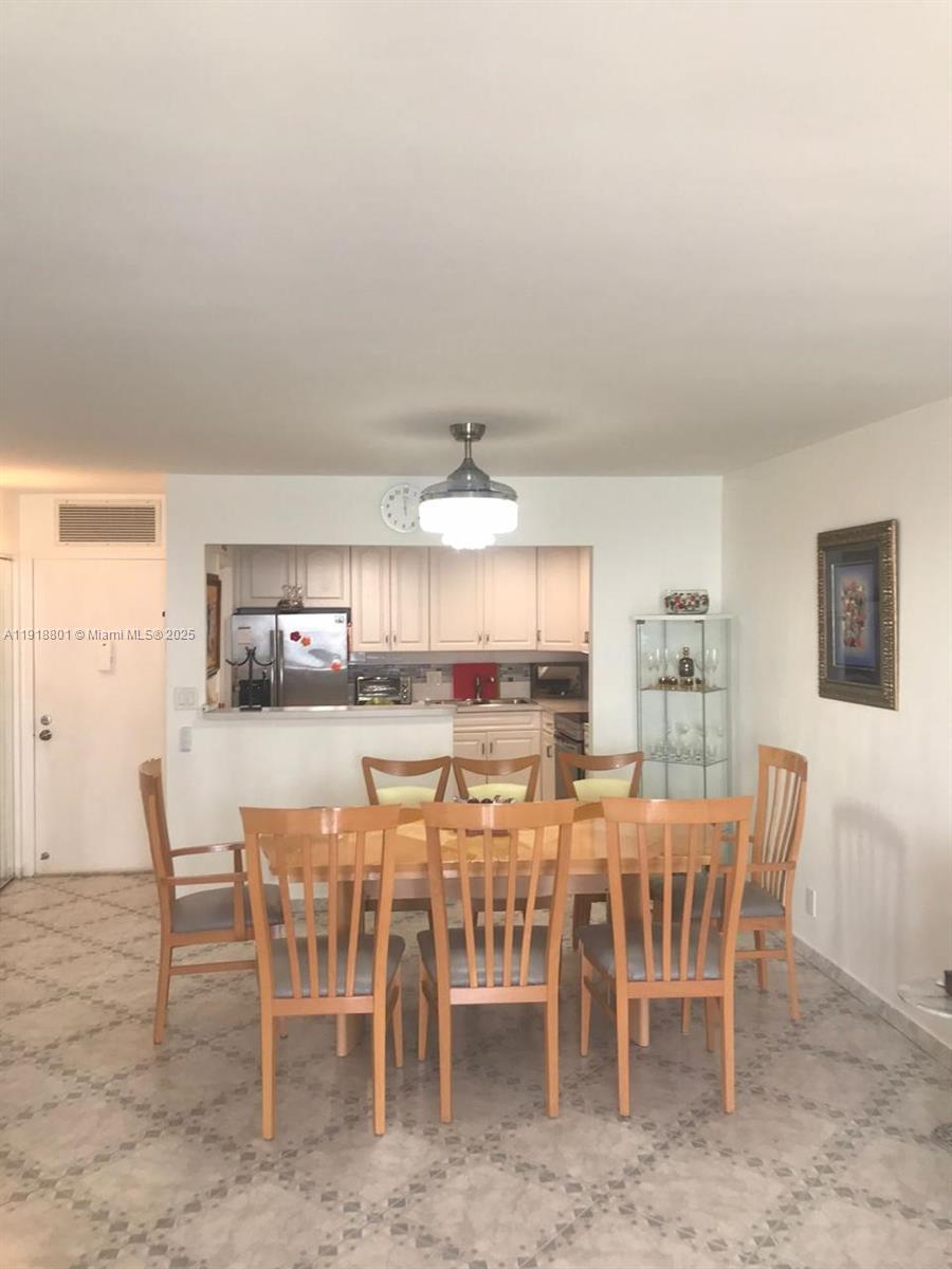 2101 South Ocean Drive, Unit 1802 Hollywood, FL 33019 - Photo 8 of 8 a view of a dining room with furniture