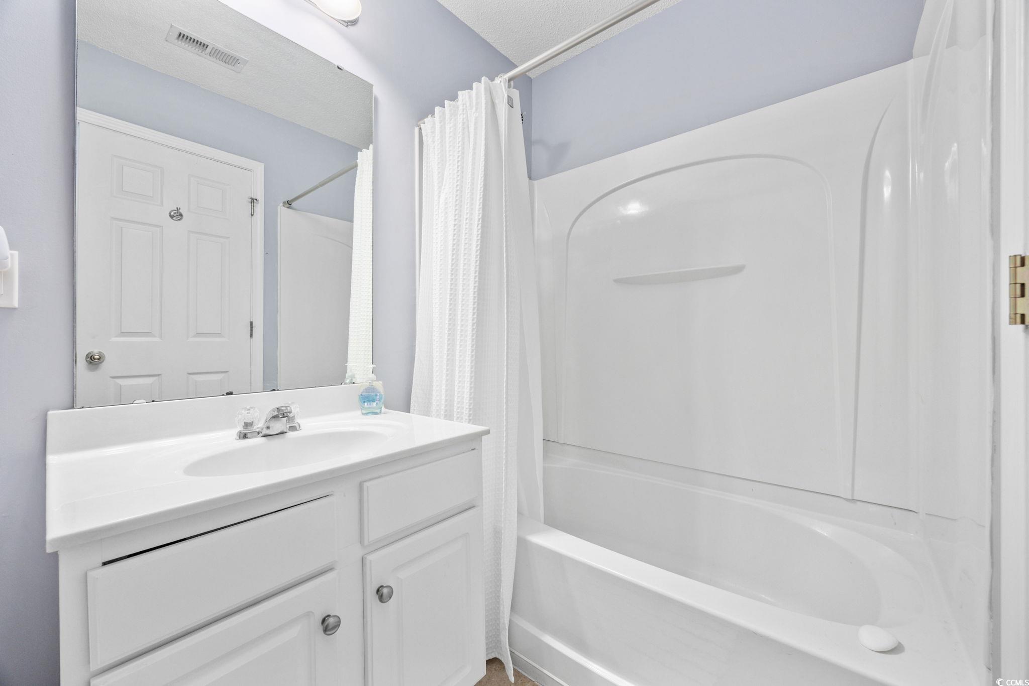 306 River Rock Lane, Unit 1304 Murrells Inlet, SC 29576 - Photo 32 of 40 Full bathroom featuring shower / bath combo and vanity