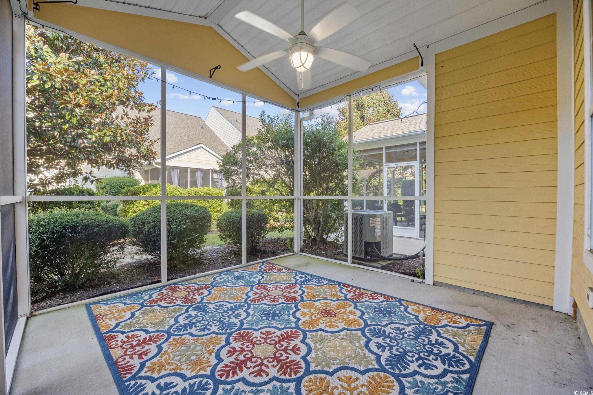 306 River Rock Lane, Unit 1304 Murrells Inlet, SC 29576 - Photo 33 of 40 Unfurnished sunroom with ceiling fan and lofted ceiling