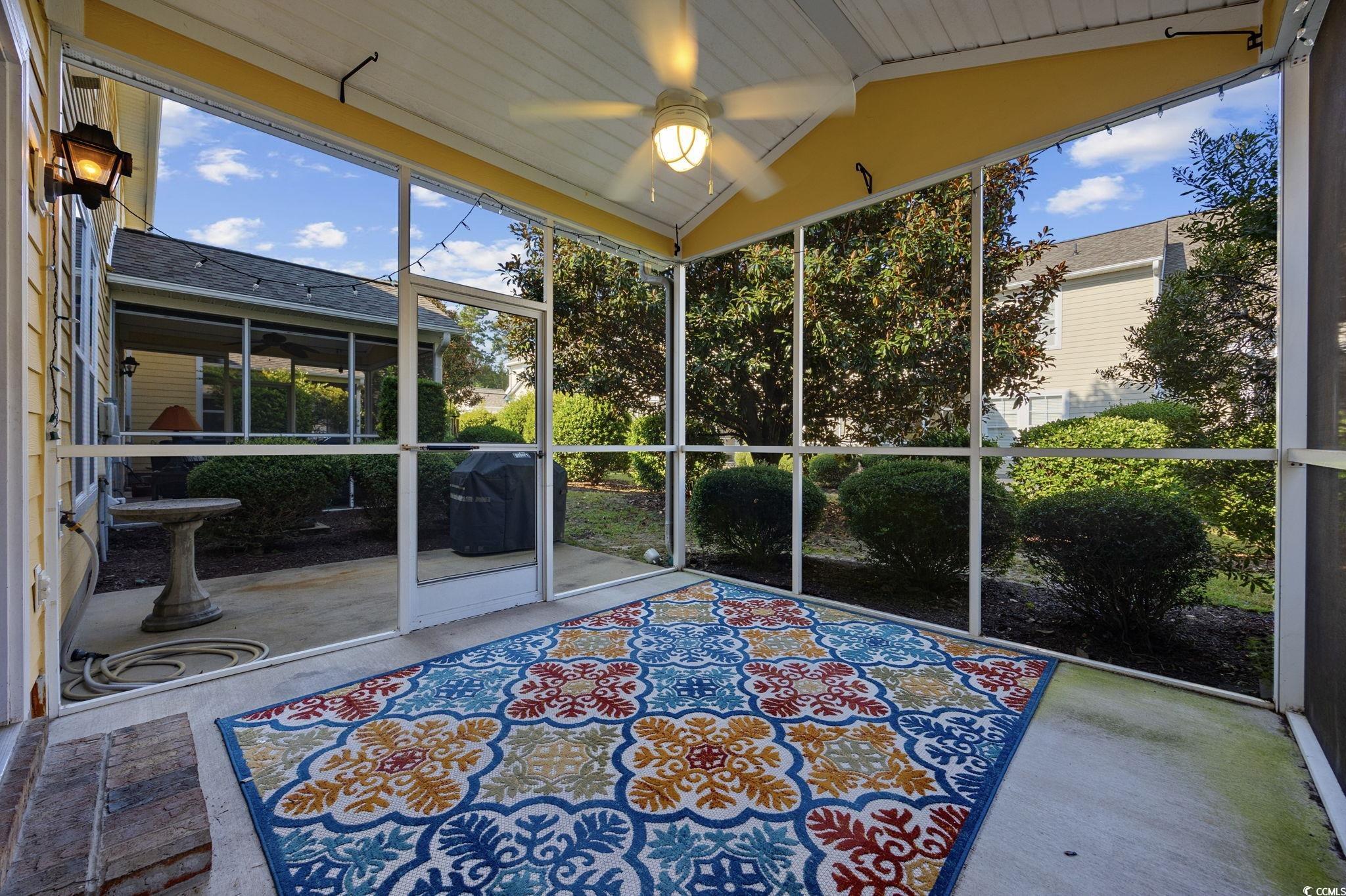 306 River Rock Lane, Unit 1304 Murrells Inlet, SC 29576 - Photo 34 of 40 Unfurnished sunroom with plenty of natural light and ceiling fan