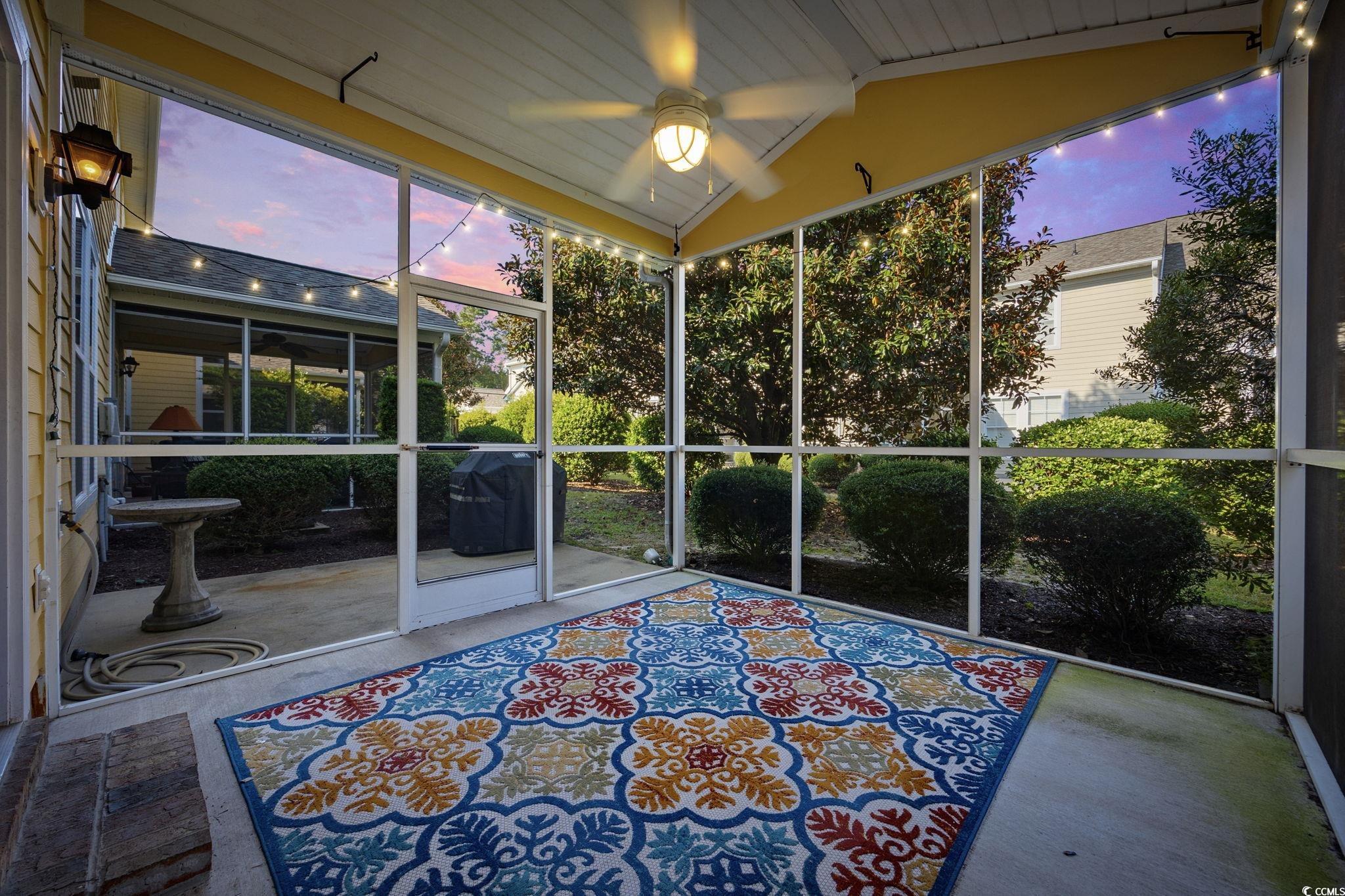 306 River Rock Lane, Unit 1304 Murrells Inlet, SC 29576 - Photo 35 of 40 Unfurnished sunroom featuring ceiling fan