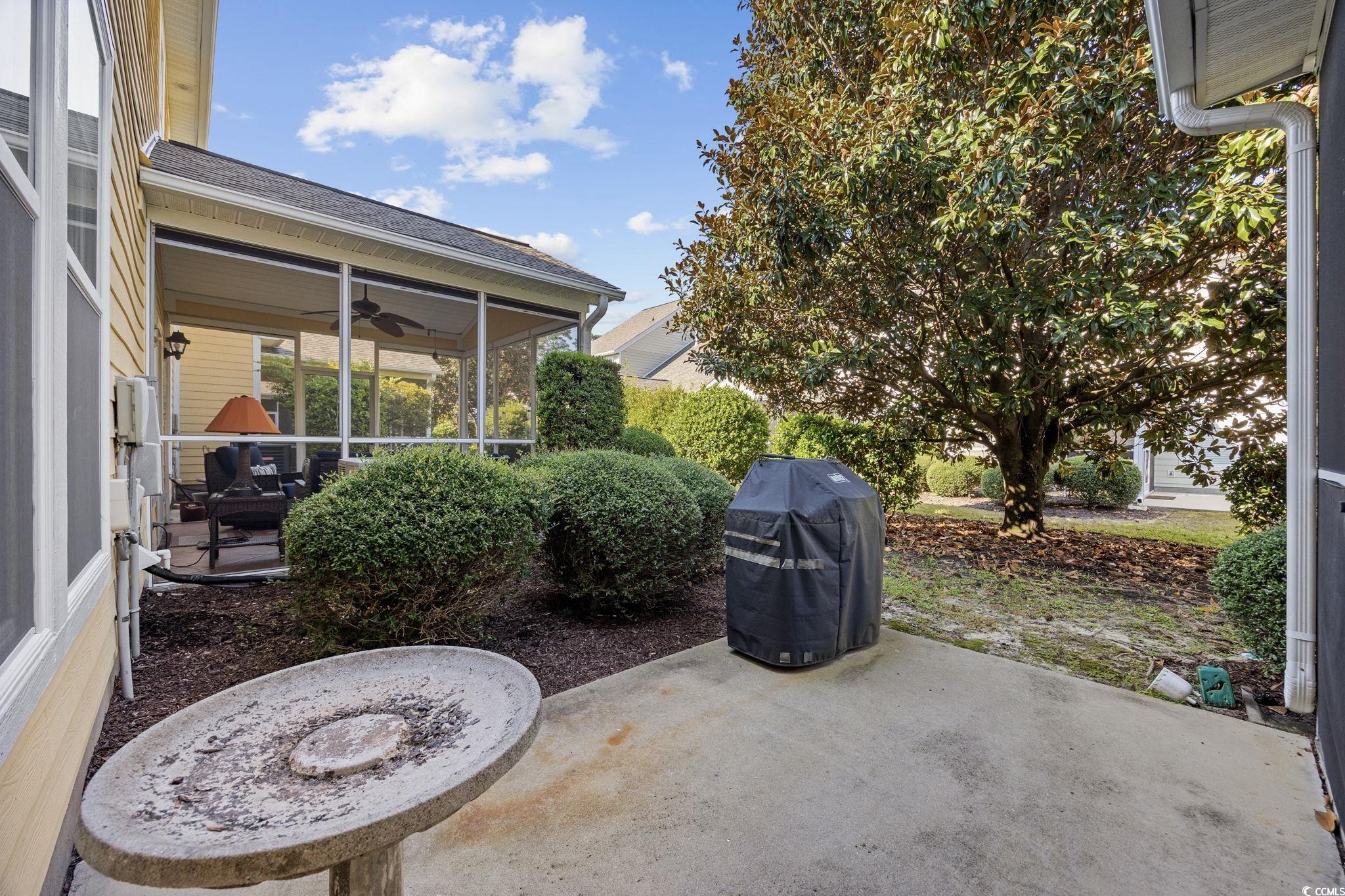 306 River Rock Lane, Unit 1304 Murrells Inlet, SC 29576 - Photo 36 of 40 View of patio with ceiling fan, area for grilling, and a sunroom
