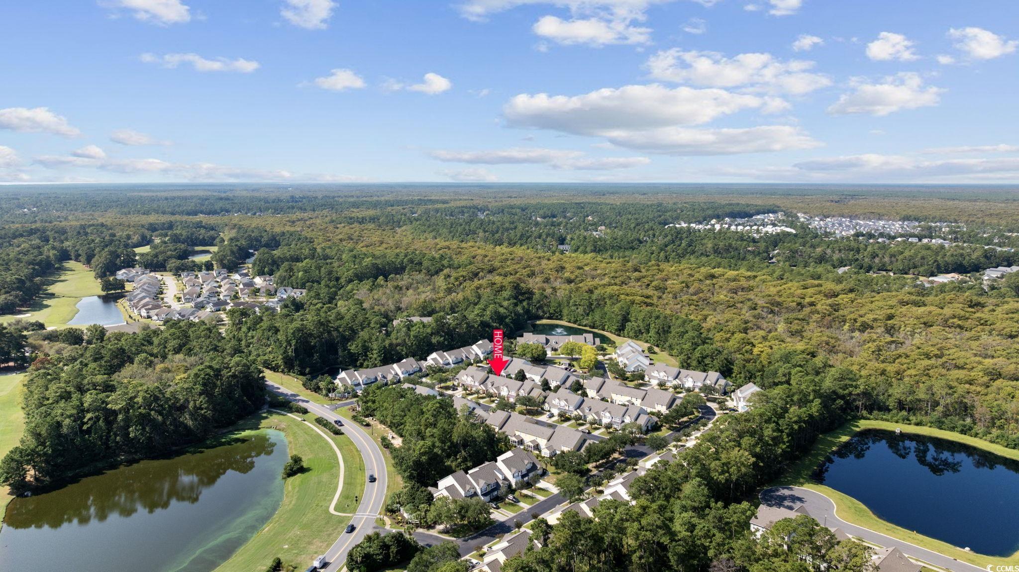 306 River Rock Lane, Unit 1304 Murrells Inlet, SC 29576 - Photo 37 of 40 Aerial overview of property's location with a large body of water and nearby suburban area