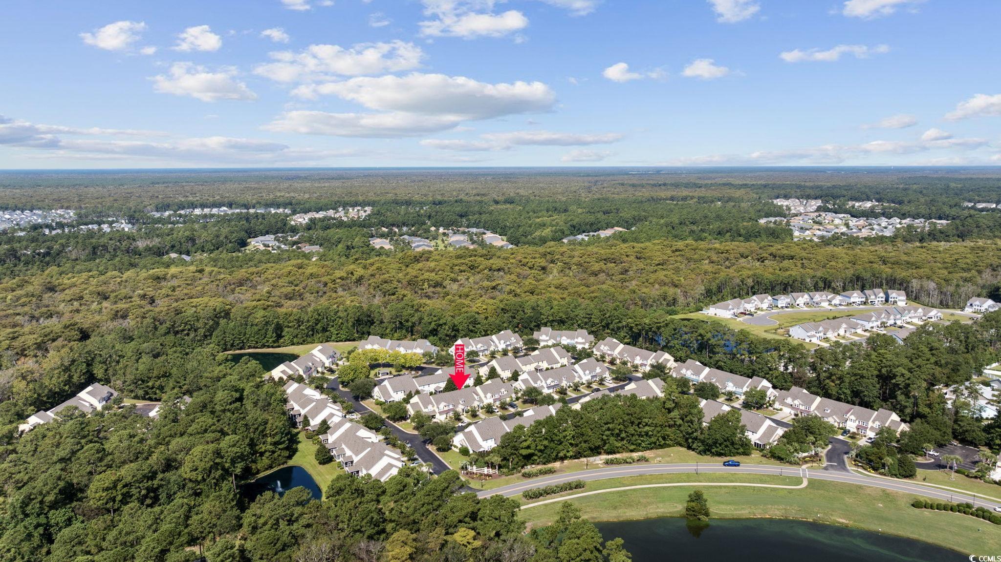 306 River Rock Lane, Unit 1304 Murrells Inlet, SC 29576 - Photo 38 of 40 View of property location with a heavily wooded area and nearby suburban area