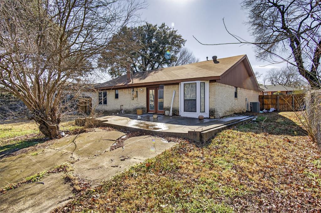 6946 Trailcrest Drive Dallas, TX 75232 - Photo 3 of 22 a front view of a house with a yard covered with snow