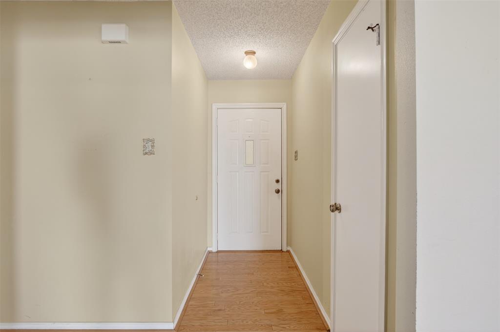 6946 Trailcrest Drive Dallas, TX 75232 - Photo 5 of 22 a view of a hallway with a white door