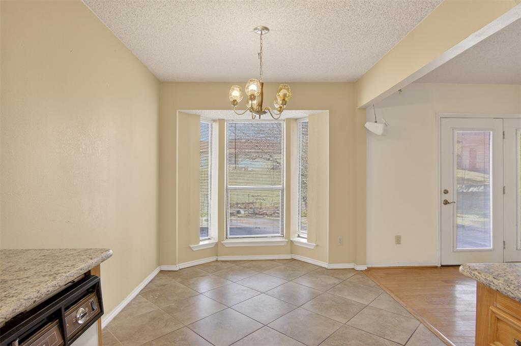 6946 Trailcrest Drive Dallas, TX 75232 - Photo 8 of 22 wooden floor in an empty room with a window