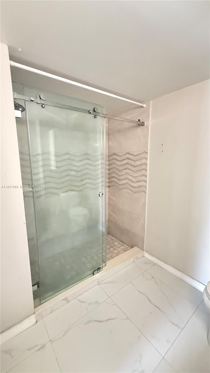 17600 Northwest 68th Avenue, Unit B2002 Hialeah, FL 33015 - Photo 18 of 38 a bathroom with a shower