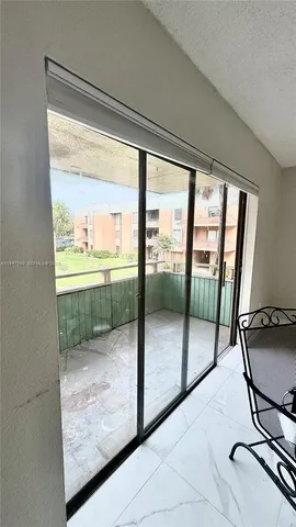 a view of a glass door of the house