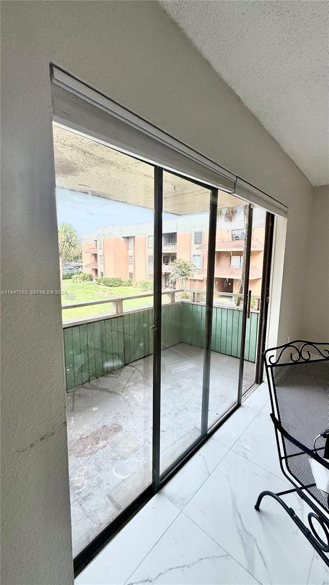 17600 Northwest 68th Avenue, Unit B2002 Hialeah, FL 33015 - Photo 22 of 38 a view of a room with gym equipment