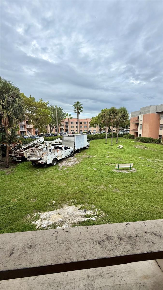 17600 Northwest 68th Avenue, Unit B2002 Hialeah, FL 33015 - Photo 27 of 38 a view of a lake with houses