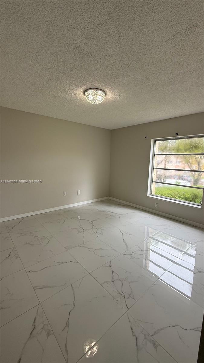 17600 Northwest 68th Avenue, Unit B2002 Hialeah, FL 33015 - Photo 29 of 38 a view of empty room with window