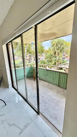 a bathroom with a toilet and shower