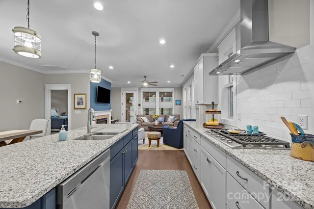 a large kitchen with granite countertop lots of counter top space