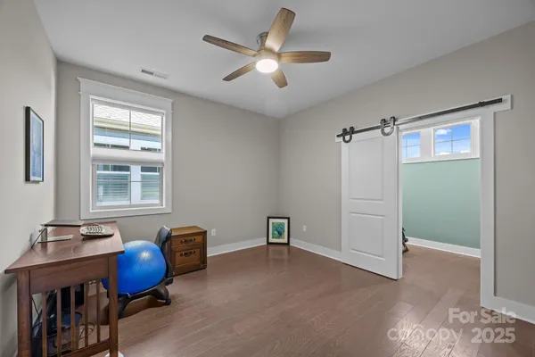 a work room with furniture and window