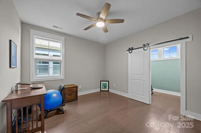 a work room with furniture and window