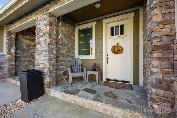 a front view of a house with outdoor seating