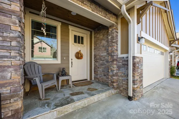 a view of front door of house with stairs