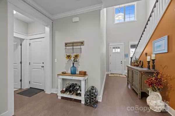 a view of hall way with furniture and toys
