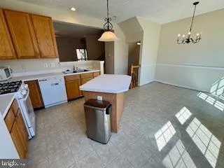a kitchen that has a lot of cabinets in it