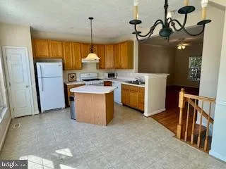 a view of a room with furniture and windows