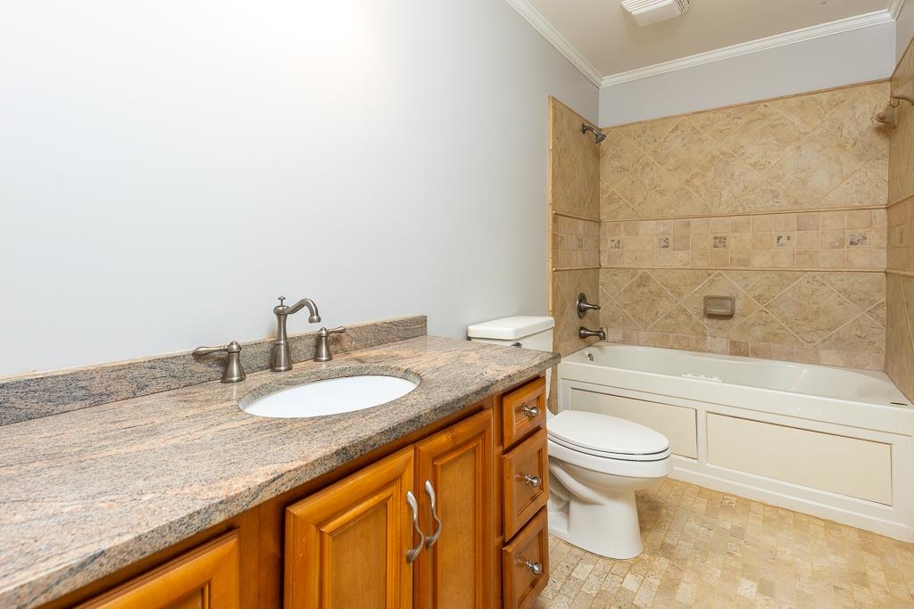 1806 Kimbrough Road Germantown, TN 38138 - Photo 20 of 26 a bathroom with a granite countertop sink toilet and shower