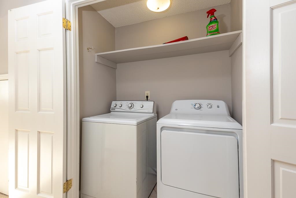 1806 Kimbrough Road Germantown, TN 38138 - Photo 24 of 26 a utility room with dryer and washer
